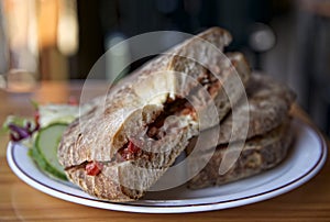 Traditional maltese dish - ftira. Malta food. Typical Maltese bread called ftira accompanied by french fries photo