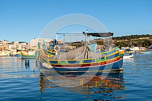 Traditional Maltese fishing boat - Luzzu photo
