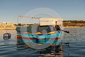 Traditional Maltese fishing boats - Kajjik photo