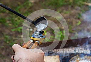 Traditional manual metal casting process to form aluminum tin press bullets