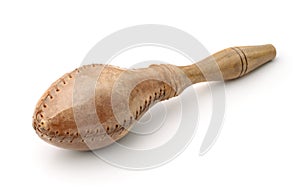 Traditional maraca made of leather and wood