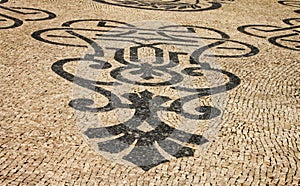 Traditional marble mosaic on street in Lisbon
