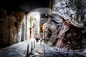 Traditional mask with face of Pulcinella in Spaccanapoli Street, in the old town of Naples, Italy photo