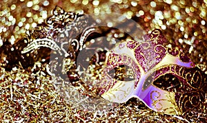 traditional masks against the background of confetti and streamers