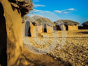 Traditional massai hut made of earth and wood photo