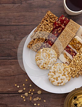 Traditional Mawlid Sweets on Brown Wooden Table photo