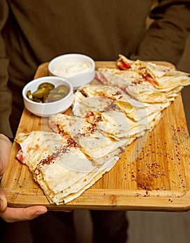 Traditional meat vegetable gutab, qutab, gozleme on wooden board photo