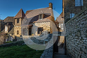 Traditional medieval house against a blue sky in Sarlat, France