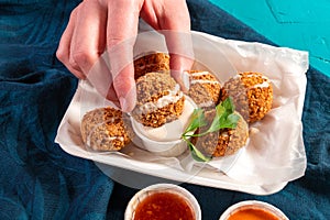 Traditional Mediterranean Arabic vegan falafel balls with a variety of dips