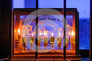 Traditional Menorah (Hanukkah Lamp) with olive oil candles photo