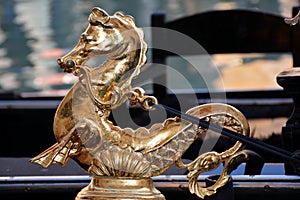 Traditional metal decoration in the form of a seahorse on board a gondola - Venice, Italy