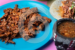 Mexican beef barbacoa tacos on colorful background photo