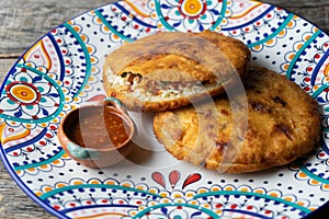 Mexican fried gorditas with chicharron photo