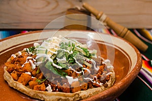 Traditional mexican sope with chorizo photo