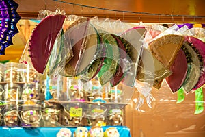 Traditional Mexican sweets wafers with pepita and caramel hanging in a stall at the Feria del AlfeÃ±ique in Toluca, Mexico.