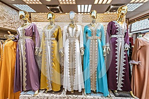 Traditional Middle Eastern and Arab women dresses and robes on mannequins on the market