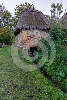 Traditional mill with a broom roof, Teito, in the town of Valle de Lago in the council of Somiedo, in Asturias. photo