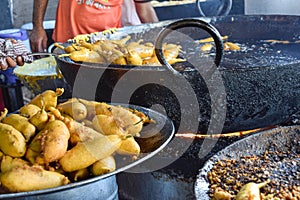 Traditional Mirch Pakoras Indian food as Samosas fried on street food and market