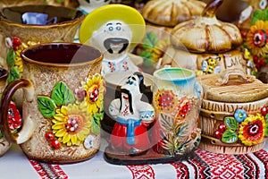 Traditional and modern style handmade ceramic clay souvenir bowls with handpainted humorous figures of Ukrainian kozaks