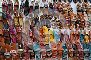 Traditional mojari shoes Juttis of various designs on display. These are shoes made from leather and decorated with various