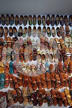 Traditional mojari shoes Juttis of various designs on display. These are shoes made from leather and decorated with various