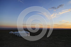 Traditional Mongolian Gers in a camp at sunset