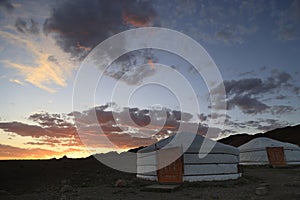 Traditional Mongolian Gers in a camp at sunset