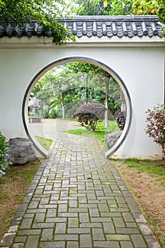 Traditional moon gate in Chinese garden photo