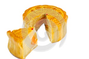 Traditional Mooncakes with one cut up to show egg yolk