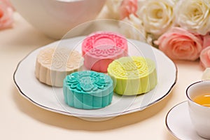 Traditional mooncakes on table setting. Snowy skin mooncakes. Ch