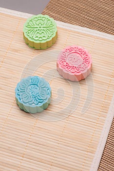Traditional mooncakes on table setting. Snowy skin mooncakes. Ch