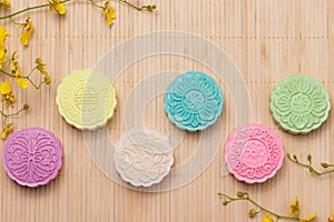 Traditional mooncakes on table setting. Snowy skin mooncakes. Ch