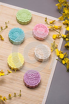 Traditional mooncakes on table setting. Snowy skin mooncakes. Ch