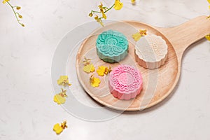 Traditional mooncakes on table setting. Snowy skin mooncakes. Ch