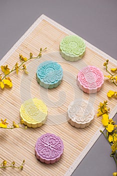 Traditional mooncakes on table setting. Snowy skin mooncakes. Ch