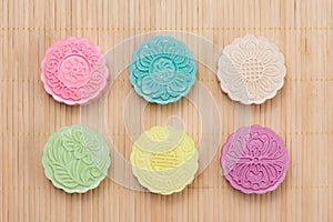Traditional mooncakes on table setting. Snowy skin mooncakes. Ch