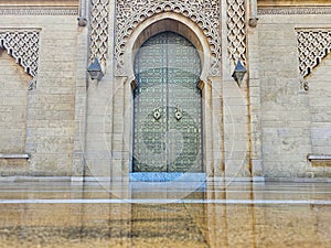 Traditional Moroccan artisanal door with moroccan mosaic tiles and architecture at the Mohammed V mausoleum in Rabat Morocco