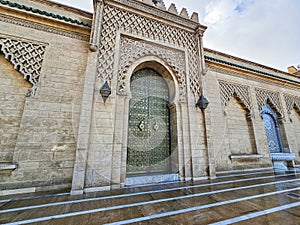 Traditional Moroccan artisanal door with moroccan mosaic tiles and architecture at the Mohammed V mausoleum in Rabat Morocco