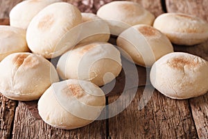 Traditional Moroccan batbout tiny bread close-up. horizontal