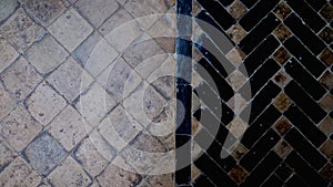 Traditional Moroccan brown and black tile floor. Abstract geometric design background footage.