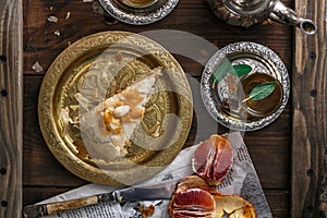 Traditional moroccan copper plate with piece of pie