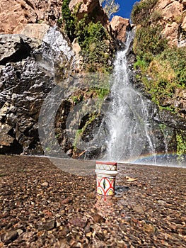 A traditional Moroccan cup of tea in the middle of a natural waterfall, Tezgi Waterfall, Taroudant Province
