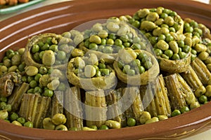 Moroccan meal with Cardoon, stuffed artichoke hearts with green peas and broad beans photo