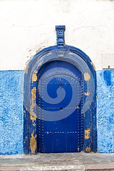 Traditional moroccan door with arch form painted blue