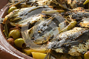 Traditional  Moroccan Tagine with stuffed sardines and vegetables