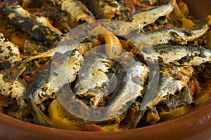 Traditional  Moroccan Tagine with stuffed sardines and vegetables