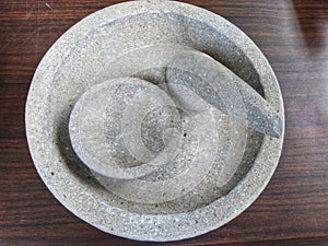 Traditional Mortar and Pestle made of stone which is usually made for grinding spices