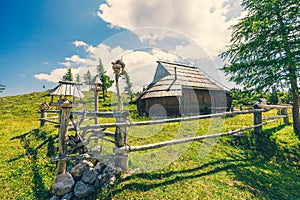 Traditional Mountain Wooden Shepherd Shelters on Big Pasture Plateau or Velika Planina in Slovenia