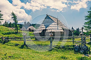 Traditional Mountain Wooden Shepherd Shelters on Big Pasture Plateau or Velika Planina in Slovenia