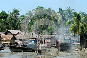 Traditional Myanmar village on estuary in Kyaikto city.